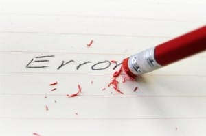 closeup of a pencil eraser correcting an error