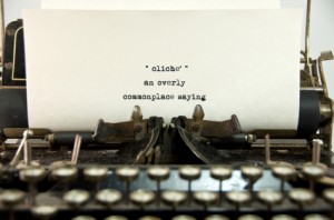 Typewriter with definition of cliche written on inserted paper