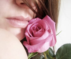 Pink rose caressing pink lips